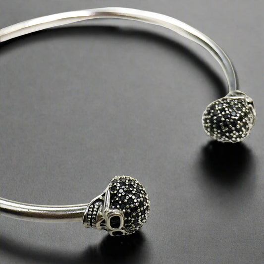 Stunning 925 silver pave flexible skull bracelet containing a skull on each end 