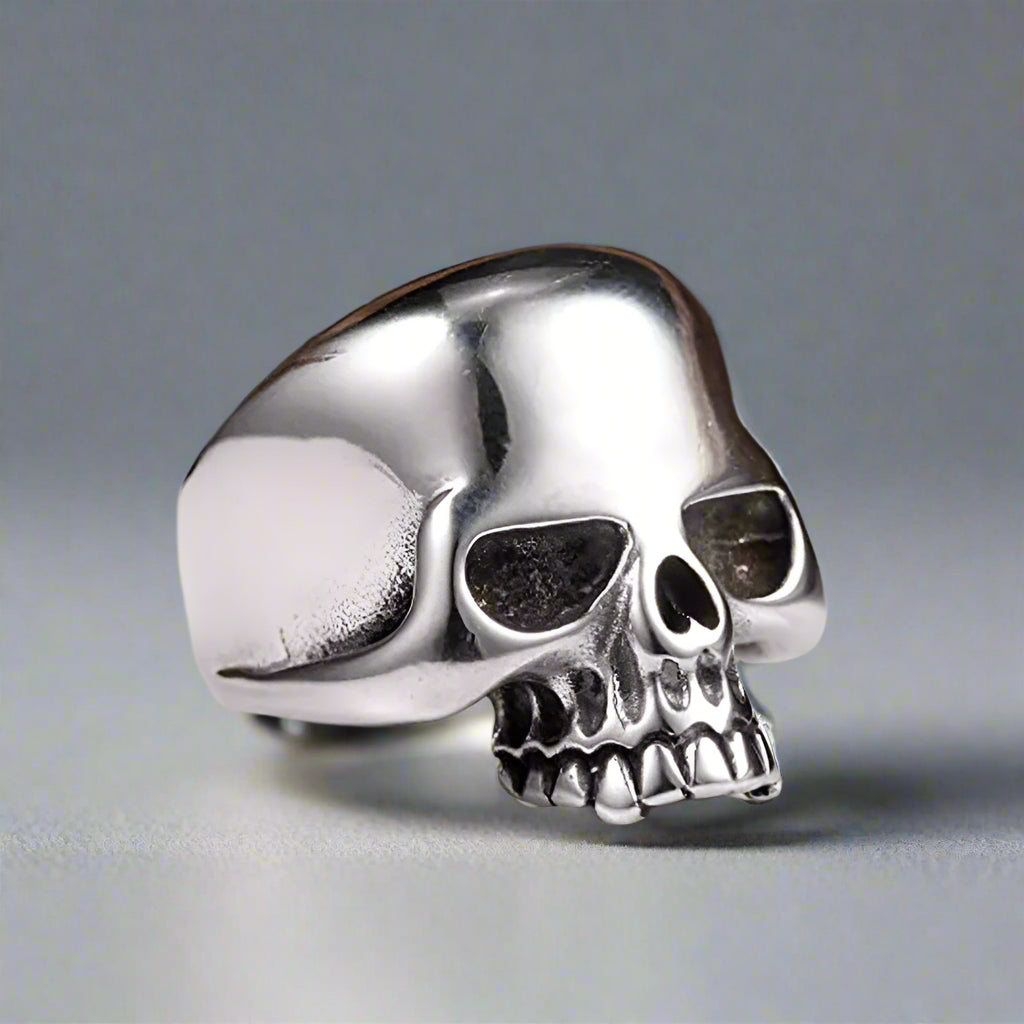 a chunky silver gothic skull ring