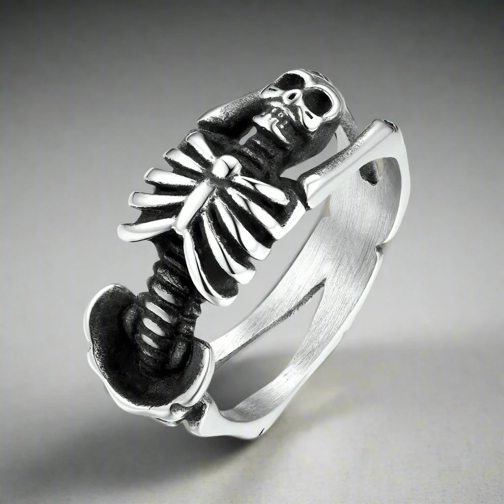 A silver skeleton ring