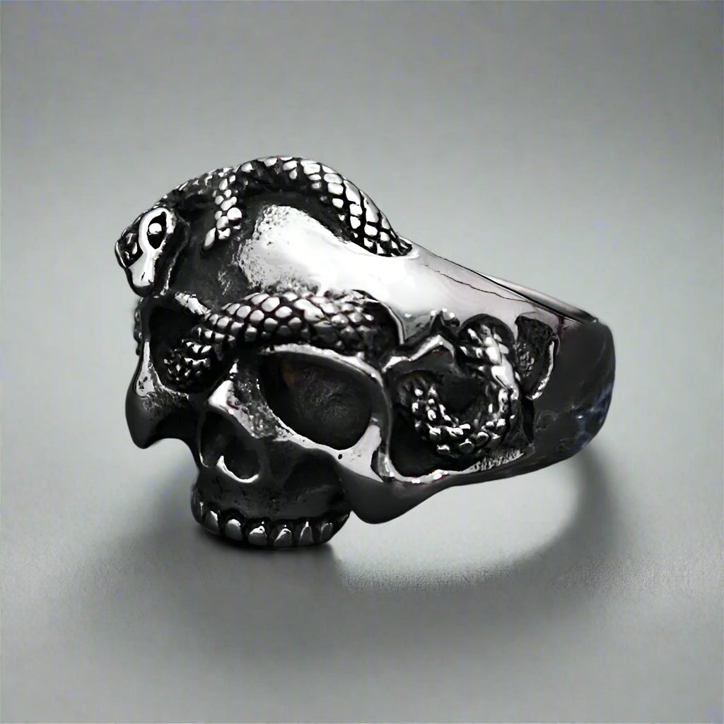 snake wrapped steel skull ring