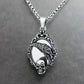 a silver skull pendant